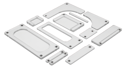 White plastic components arranged for various industrial applications.