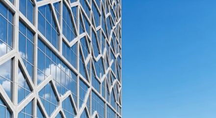 Geometric facade of modern architecture set against bright sky and building windows