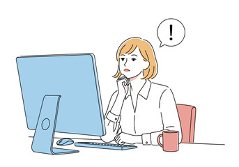 A woman sitting at a desk looking at a computer screen with an exclamation mark in a speech bubble