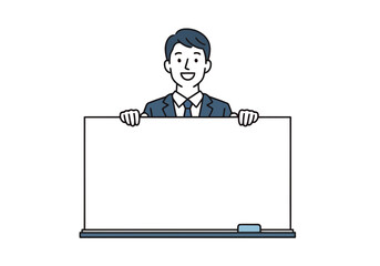 Smiling businessman in a suit holding a blank whiteboard, ready to present information or ideas to an audience