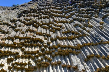 Close up of weathered textured stone with moss and lichen growth