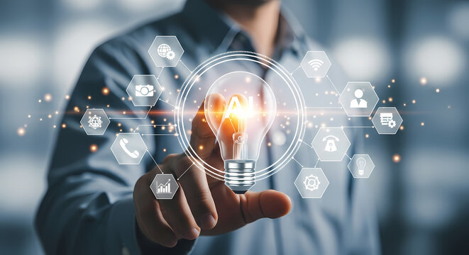 A person's hand touching a glowing light bulb with digital icons, representing innovation and new ideas for business solutions.