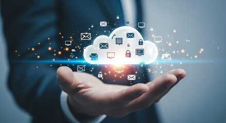 A businessman's hand holds a digital cloud with glowing data icons, representing cloud computing and data storage for modern technology.