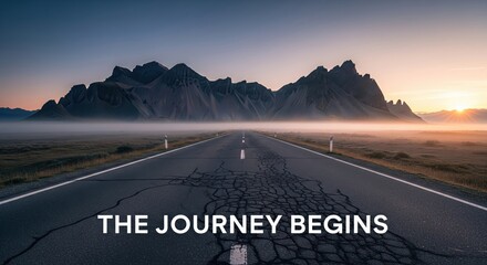 Long straight road leading to distant mountains under a dramatic sunset sky