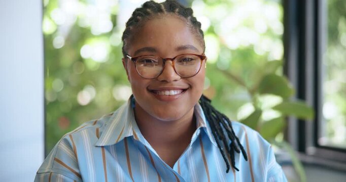Happy, black woman and face with glasses in office for journalism, online publish or service. Portrait, female person or journalist with smile for company story, career or creative business startup