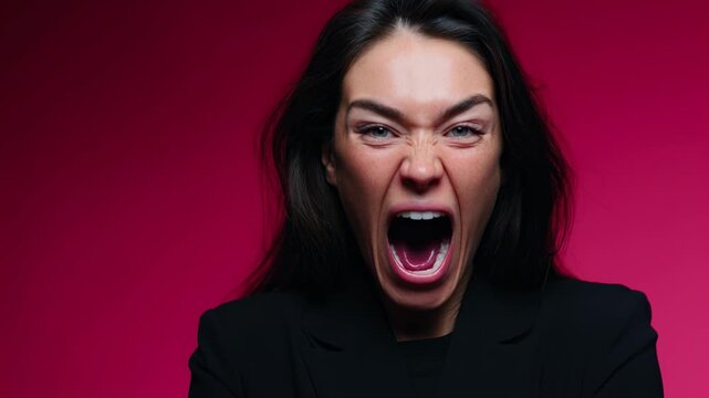 A woman demonstrates a range of emotions, scream, transitioning from calm to intense expressions. Each frame captures her raw feelings against a striking background.