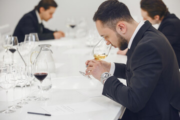 Sommelier degustate wine. Training of restaurant staff, studying alcohol list. Blind wine tasting.