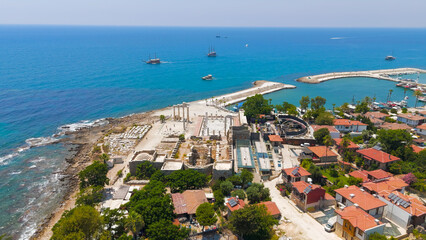 Naklejka premium Side, Manavgat, Turkey. Temple of Apollo and Athena near harbor, South Basilica. On shore, ancient ruins and Mediterranean coast aerial view on sunny day. Aerial View