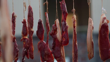 Cured Bacon and Meat Strips Hanging to Dry