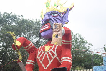 Ravnans being ignited during Dussehra festival at ramleela ground in Delhi, India, Big statue of Ravana to get fire during the Fair of Dussera to celebrate the victory of truth by Lord Rama