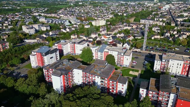 Modern neighborhood in Laval, urban development concept, France. Aerial drone backward