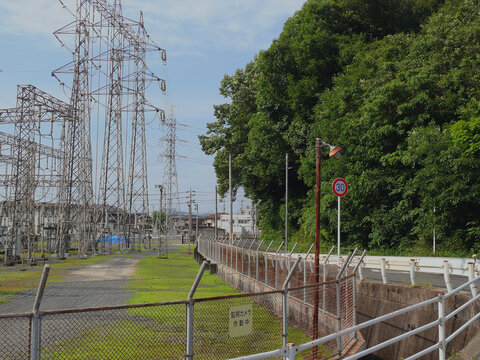 Steel fences with barbed wire are built surrounding the substation.