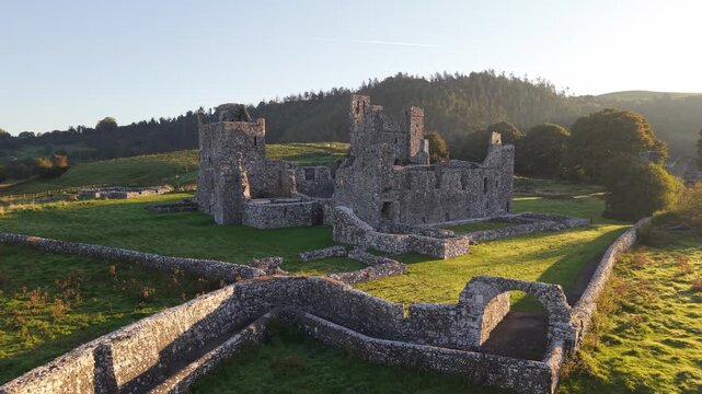 Drone view of Fore Abbey ruins in lush Ireland landscape, historic serenity