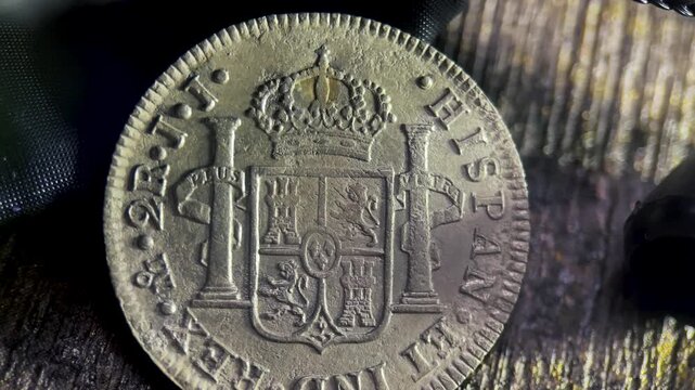2 reales Bolivia coin reverse shows the coat of arms on this old silver spanish coins back.
