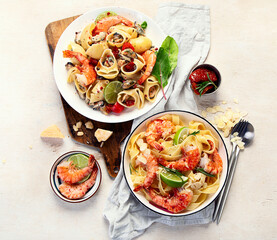 Delicious pastas with red shrimps and mussels, italian pastas, mediterranean recipe.
