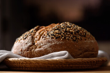 Healthy vegan dark rye sourdough bread topped with sesame and flaxseed