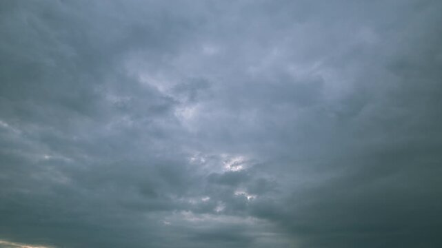 The sky is currently very dramatic and overcast, filled with clouds of various types and sizes