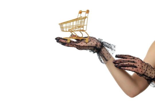 Gloved hands hold a golden shopping cart, isolated, PNG
