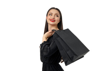 Woman smiling joyfully while holding shopping bags, isolated, PNG