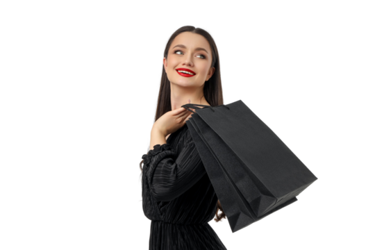 Woman smiling joyfully while holding shopping bags, isolated, PNG