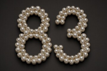 Elegant Pearls Forming Number Eight and Three on Dark Background