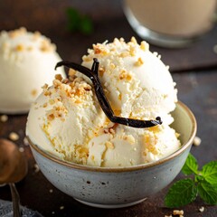 Delicious Vanilla Ice Cream Scoops Topped with Chocolate Shavings and Vanilla Bean