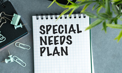 A notebook with the words Special Needs Plan written on it