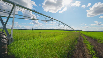 The Irrigation System is presented beautifully in the Lush Green Landscape beneath a Bright Sky