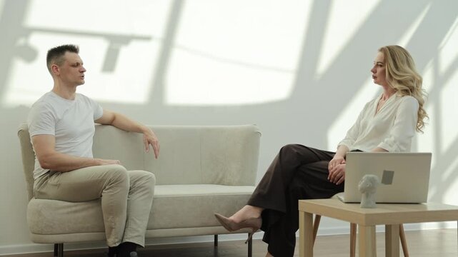 Client and practitioner engaged in a reflective healing dialogue during a wellness coaching session