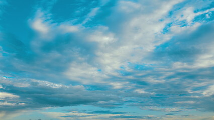 The breathtaking, scenic view of a cloudy sky painted in vibrant shades of blue