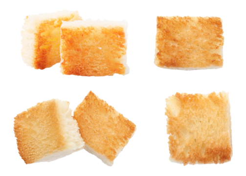 four separate pieces of perfectly toasted, square-cut bread, featuring a crisp golden brown top surface ideal for use as premium gourmet croutons or savory appetizers.