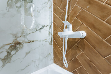 elegant shower with stylish tiles, contemporary bathroom fixture with intricate tiling accents, luxurious spainspired bathroom featuring modern fixtures and sophisticated tile work