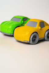 Colorful toy cars ready for play and adventure in a bright indoor setting.