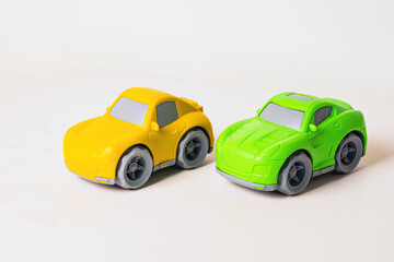 Colorful toy cars ready for play and adventure in a bright indoor setting.