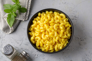 Delicious macaroni and cheese , American mac and cheese, macaroni pasta in cheesy sauce.