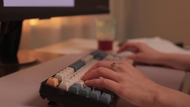 Typing on keypad with smartwatch, User engaging with numeric keypad and smartwatch, Focused individual performing data entry with compact devices in streamlined workspace