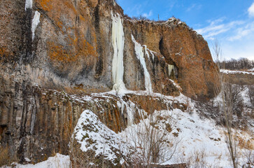 snow and frozen waterfalls on the outcrops of Arpa river canyon in Jermuk (Vayots Dzor, Armenia)