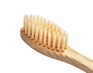 Close up of a bamboo toothbrush with natural bristles on a black background highlighting its sustainable design and eco-friendly material