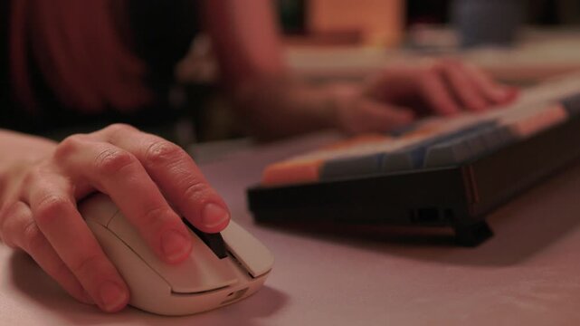 Typing on keypad with smartwatch, User engaging with numeric keypad and smartwatch, Focused individual performing data entry with compact devices in streamlined workspace