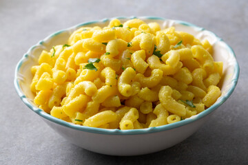 Delicious macaroni and cheese , American mac and cheese, macaroni pasta in cheesy sauce.