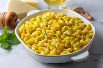 Delicious macaroni and cheese , American mac and cheese, macaroni pasta in cheesy sauce.