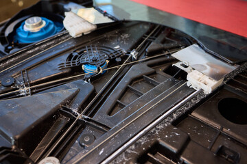 Mechanical component closeup, Workshop lighting highlights dust marks on machine parts, Maintenance scene revealing radial blades and mounting slots of mechanical device