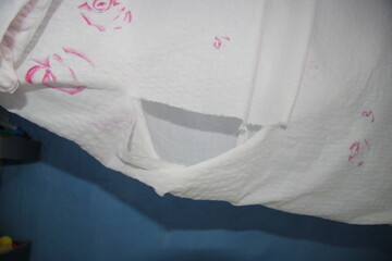 torn pink fabric hangs, large,