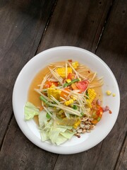 Somtum with corn on dish background