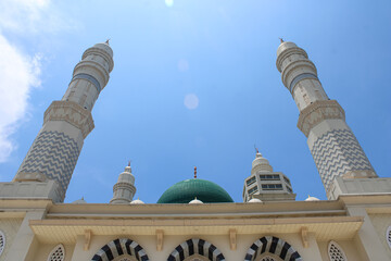 Grand Mosque Architecture with Twin Minarets and Green Dome