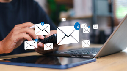 Person checking smartphone with email icons floating above. Concept of digital communication, mobile inbox, real-time notification, and online message system.