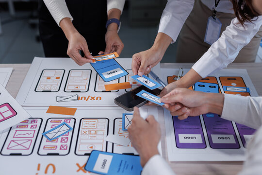 Ux ui designers collaborating on mobile application prototyping