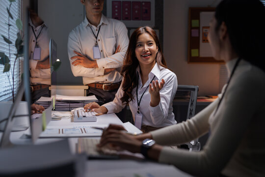 Business people collaborating late night in office