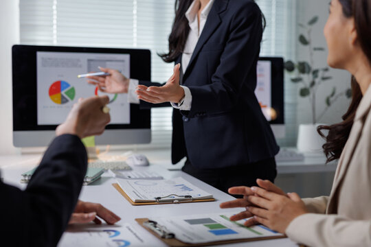 Businesswoman presenting financial data planning strategy meeting