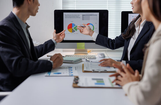 Business people discussing data analysis during corporate meeting